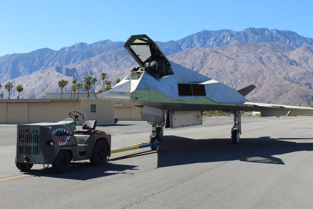 Harlan Tractor pulling a stealth fighter at the Palm Springs Air Museum